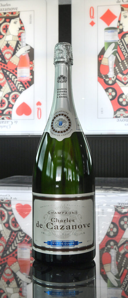 Magnum Tête de Cuvée et dame de carreaux en arrière-plan / Magnum Tête de Cuvée with dame de carreaux in the background